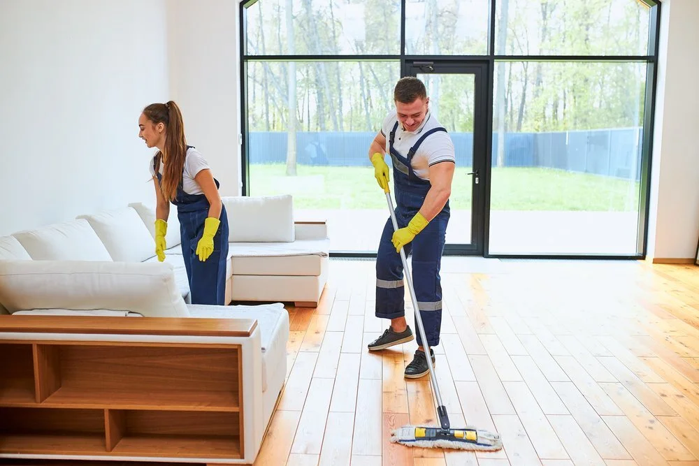 man and woman cleaning after renovations in highland village